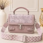 Soft, feminine, and romantic, perfectly complemented by a tonal pink-and-white patterned strap