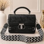 Sleek, timeless, and effortlessly edgy with a stark black-and-white chevron strap