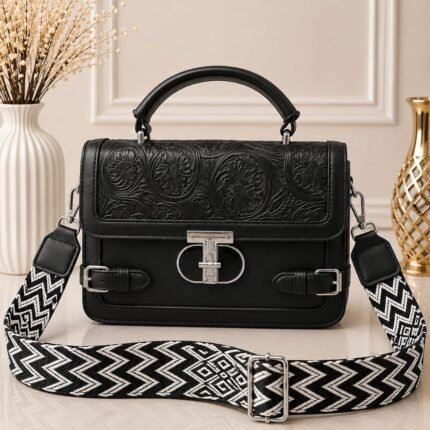Sleek, timeless, and effortlessly edgy with a stark black-and-white chevron strap