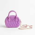 Women's lavender textured mini dome handbag featuring top handle and gold chain strap