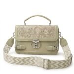 Sage green floral embossed faux leather crossbody satchel bag with silver clasp and patterned wide strap.