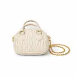 Women's ivory textured mini dome handbag featuring top handle and gold chain strap