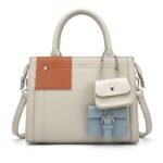 Elegant off-white and pastel blue multi-pocket fashion handbag for women.