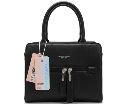 Classic black structured satchel purse with top handles and dual zipper tassels.
