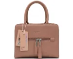 Structured dusty pink faux leather handbag with top handles and front zip tassels.