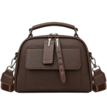 Deep chocolate brown textured leather dome satchel crossbody bag with studded front flap and silver zippers.