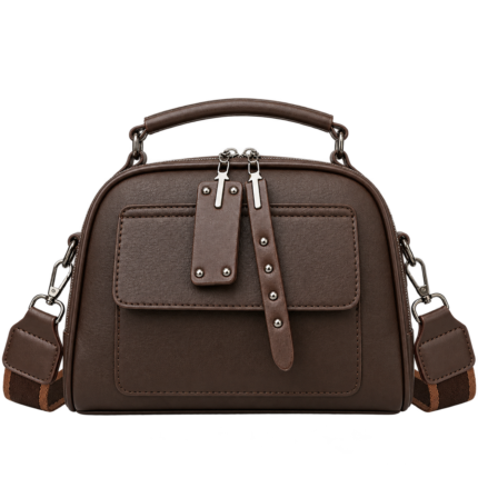 Deep chocolate brown textured leather dome satchel crossbody bag with studded front flap and silver zippers.
