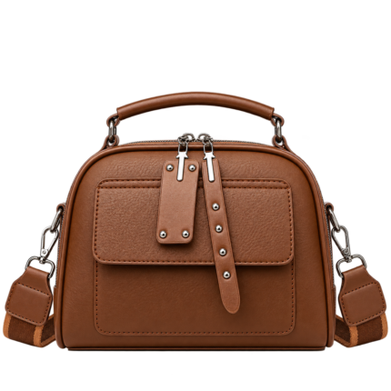Warm cognac saddle brown top handle dome satchel purse with front pocket and studded zipper extensions.